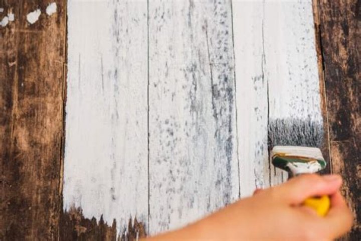 Can you paint over finished wood without sanding?