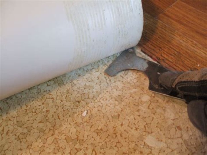 Do I need to remove vinyl floor before tiling?