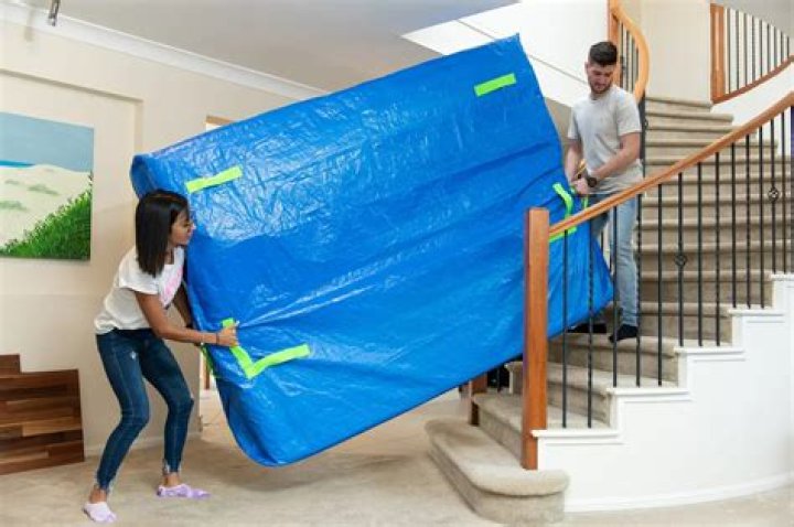 How can I lift my mattress upstairs by myself?