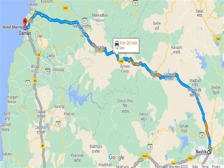 How can I reach Daman from Nasik?