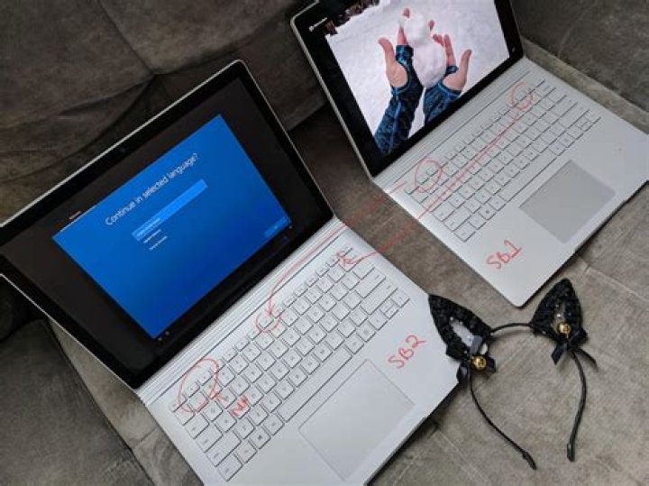 How can you tell the difference between surface Book 1 and surface 2?