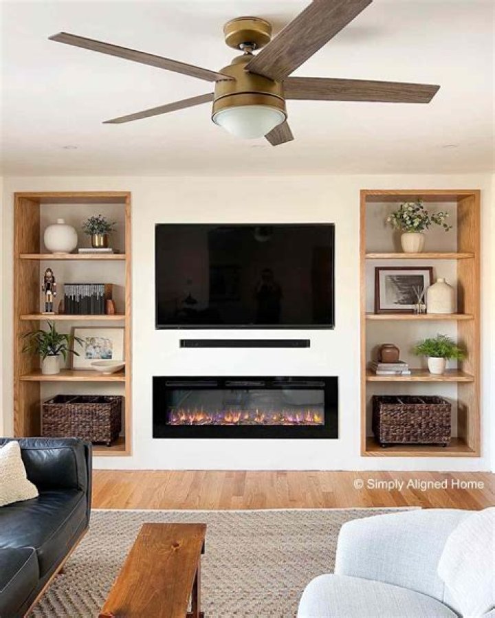 How do I change the bulb in my wall mounted electric fire?