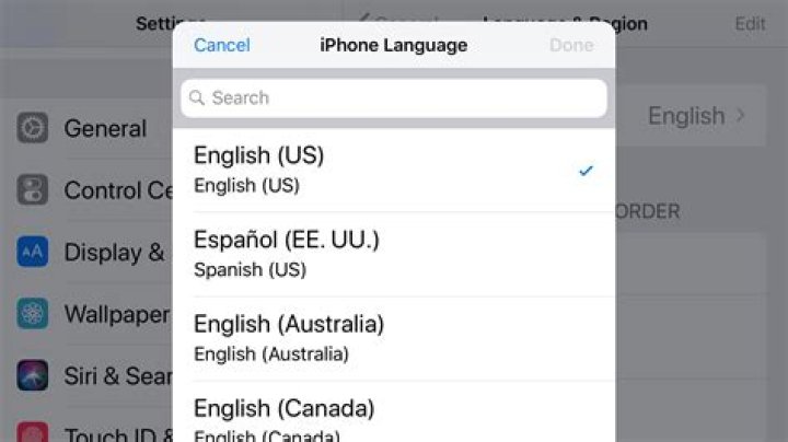How do I change the language on my locked iPhone?