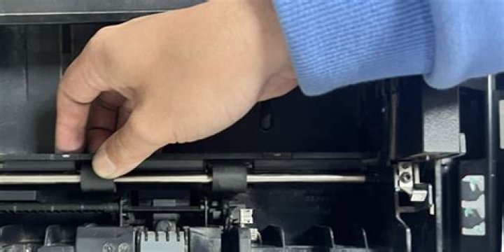 How do I clean the ink roller on my calculator?