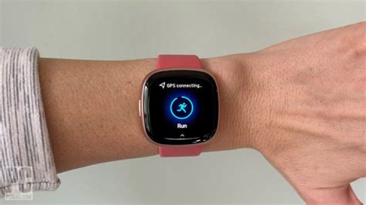 How do I connect my headphones to my Fitbit versa?