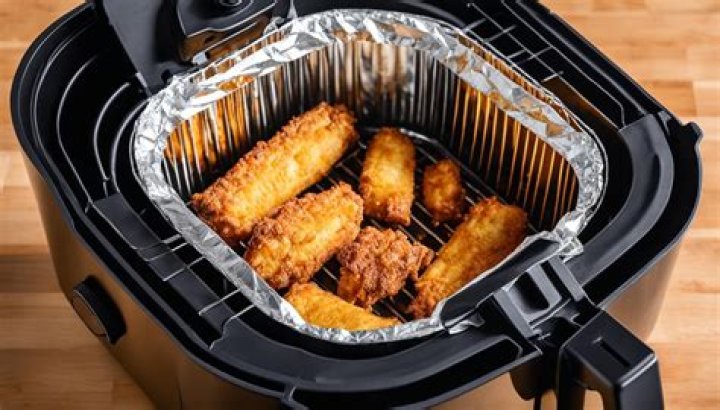 How do I get the chemical smell out of my air fryer?