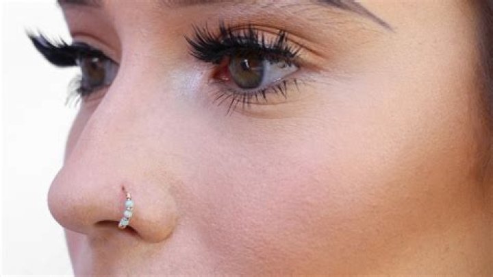 How do I keep my nose ring from sticking out?