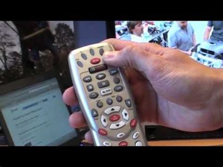 How do I program my Comcast GREY remote to my cable box?