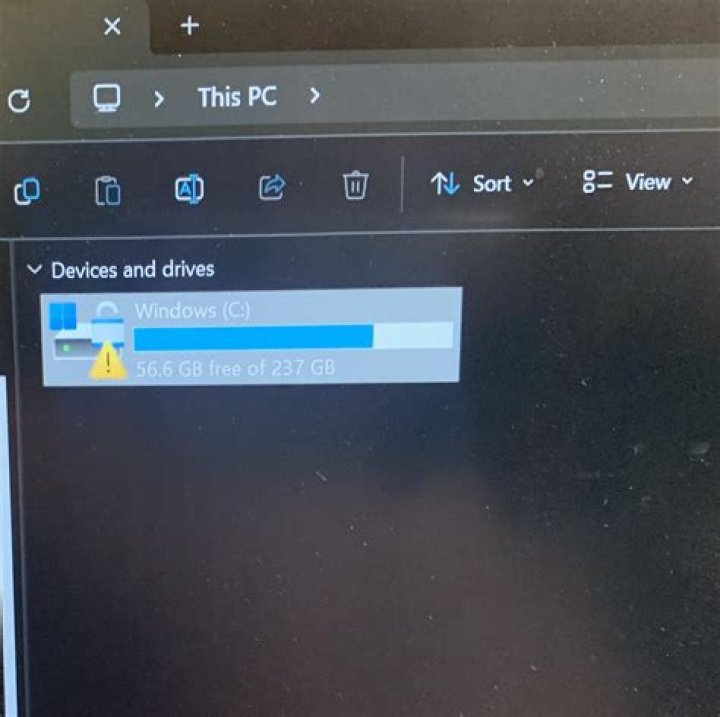 How do I remove the lock symbol on my folders in Windows 7?