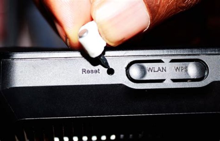 How do I reset my Synology router?