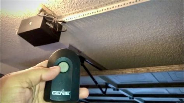 How do I reset the frequency on my garage door opener?