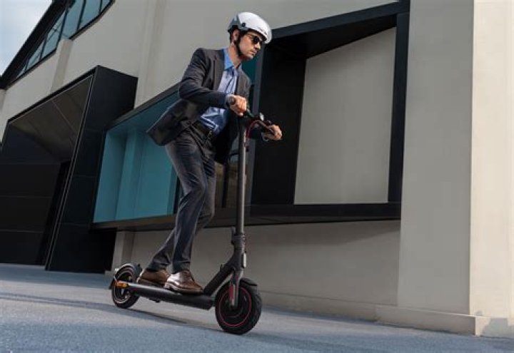 How do I start my MI electric scooter?