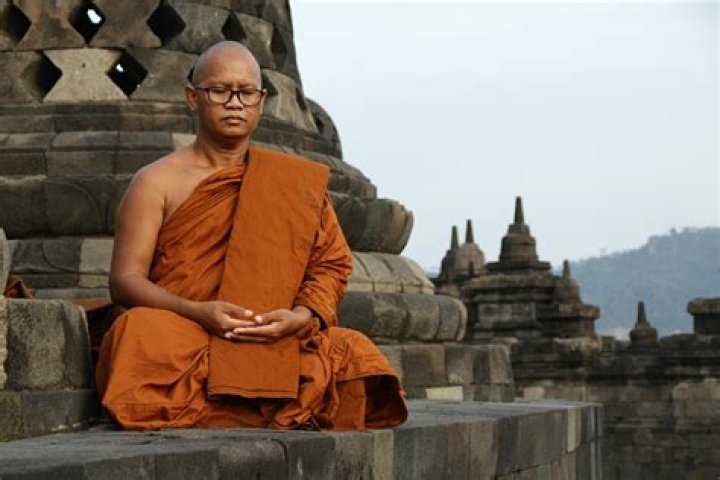 How do Monk sit?