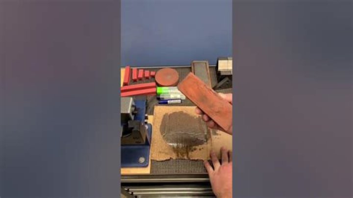 How do you clean a clogged sharpening stone?