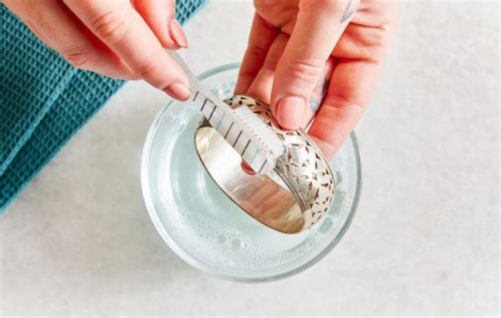How do you clean silver enamel jewelry?