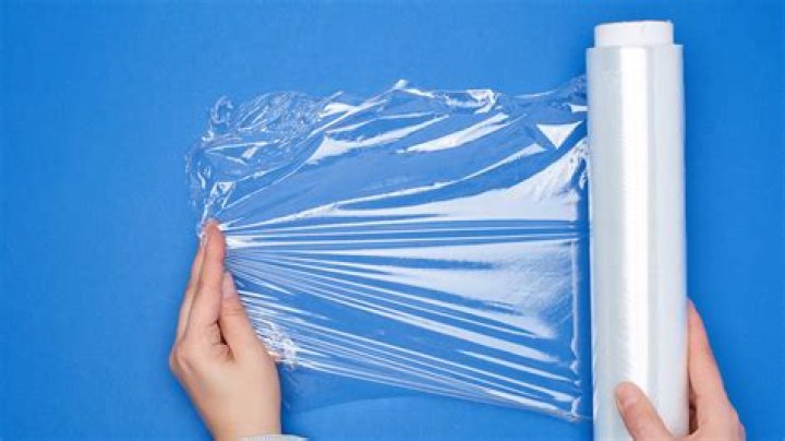How do you cut a plastic wrap roll?