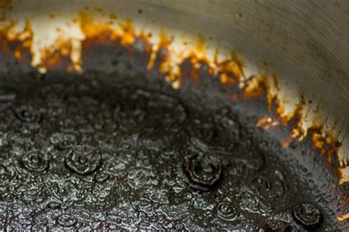 How do you get burnt stuff off a baking sheet?