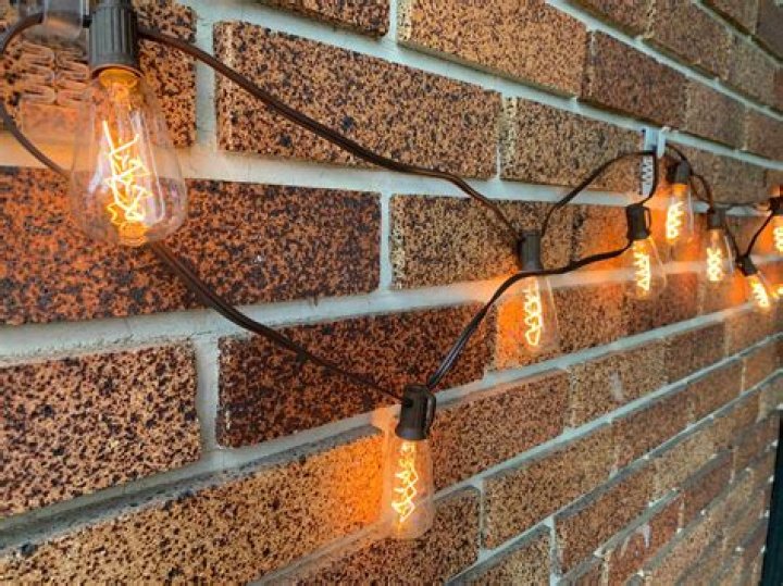 How do you hang outdoor string lights on brick?