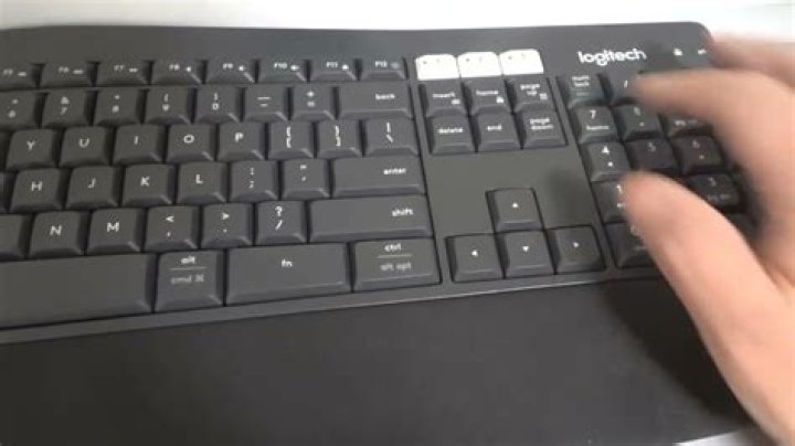 How do you program a Logitech keyboard key?