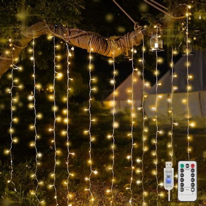 How do you put fairy lights on a curtain pole?