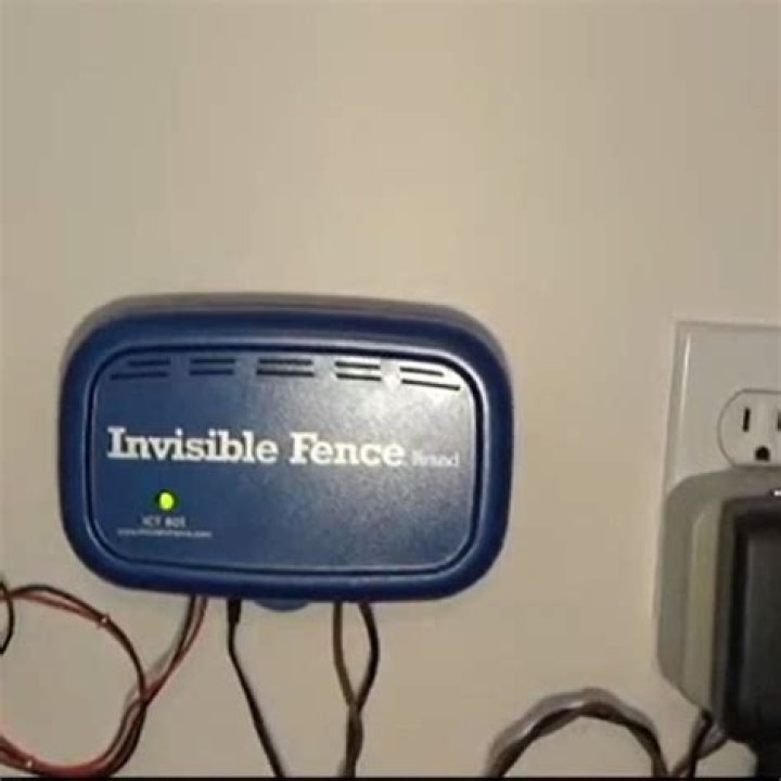 How do you reset an invisible fence transmitter?