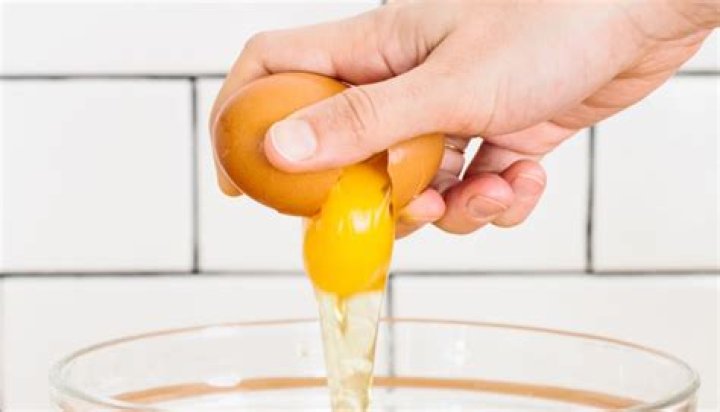 How do you scramble an egg without breaking the shell?