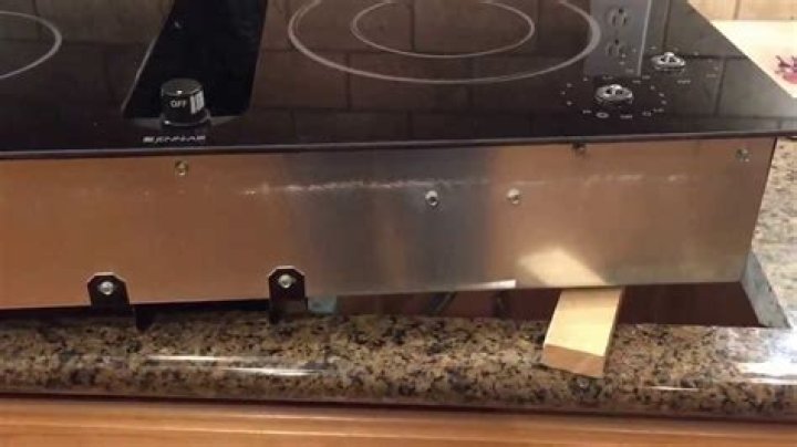 How do you turn on a Jenn Air cooktop?