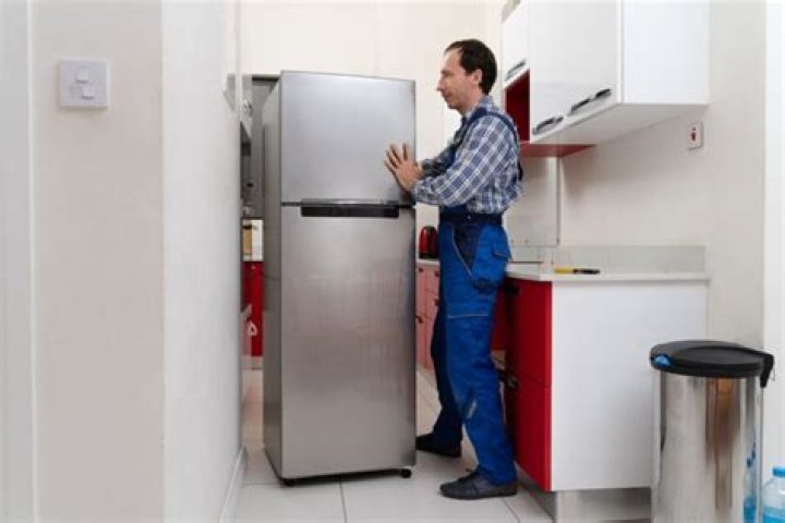 How long should you wait to turn on a fridge after moving it?