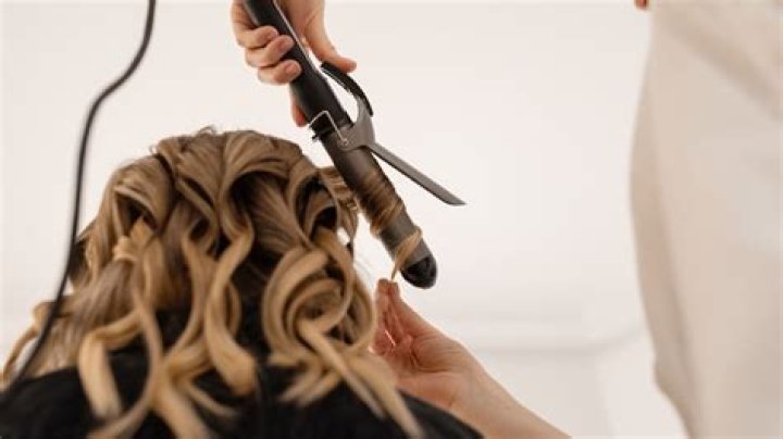 Is a flat iron more damaging than a blow dryer?
