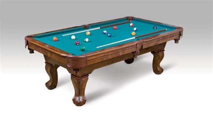 Is it bad to sit on a pool table?