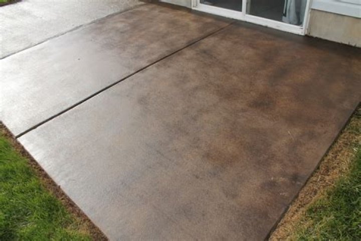 Is it better to paint or stain outdoor concrete?