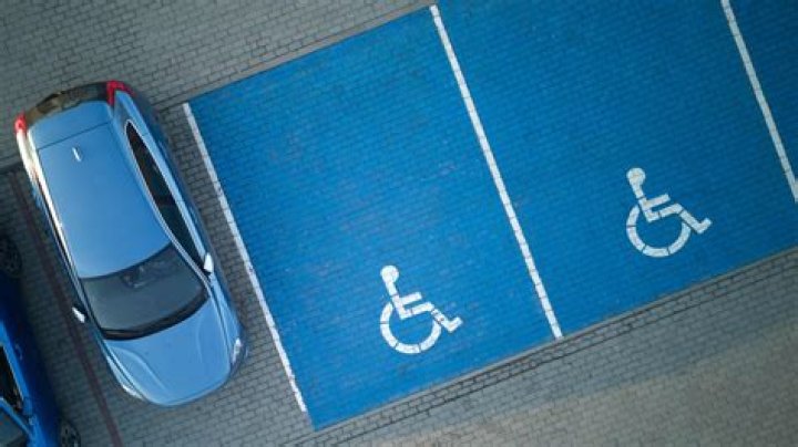Is it illegal to park in disabled spaces Qld?