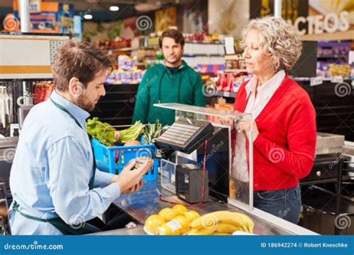 What does a cashier do at a grocery store?
