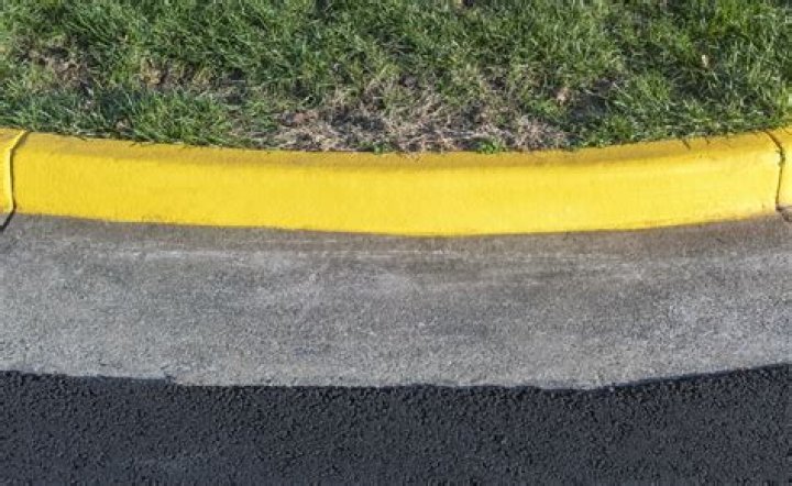 What does orange paint on sidewalk mean?
