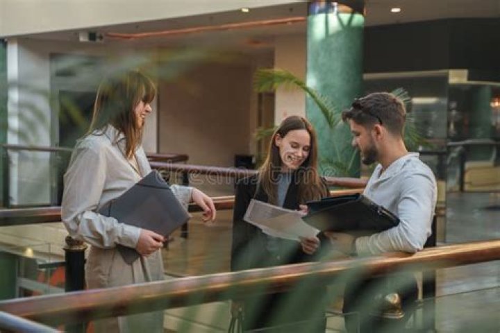 What is a group of three people working together called?