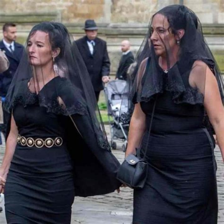 What is a professional mourner called?