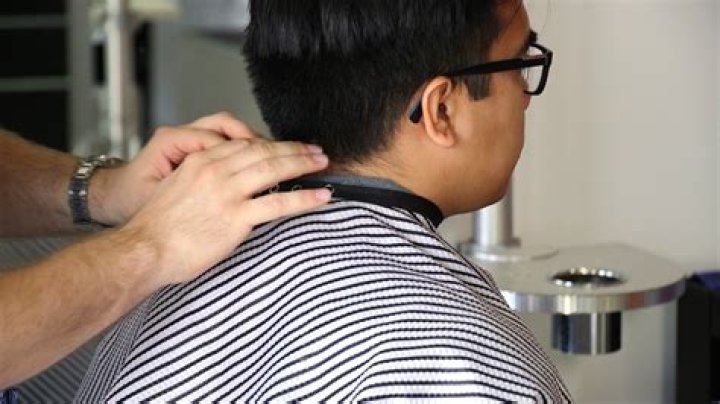 What is draping in hairdressing?