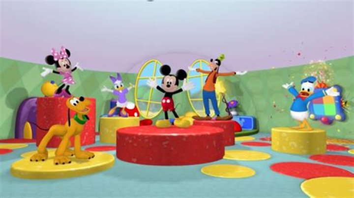 What is Mickey Mouse doing when the brooms overfill the well?