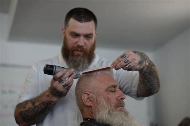 What is the difference between a barber and a cosmetologist?