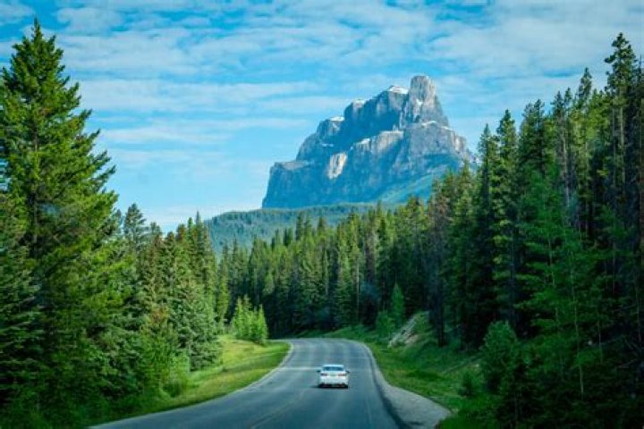 What is true of the highway that cuts through Banff National Park?