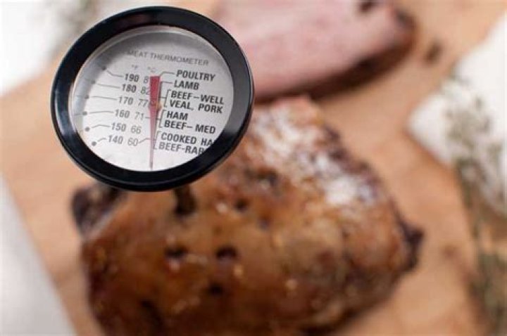 What temperature does heat disinfection occur in food?