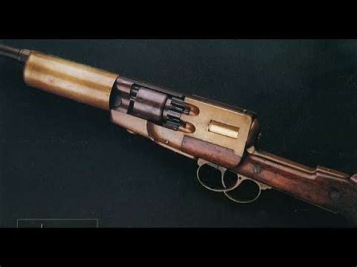 What was the first handheld automatic gun?
