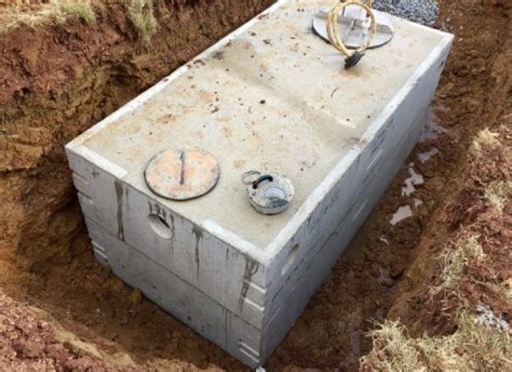 When were concrete septic tanks first used?
