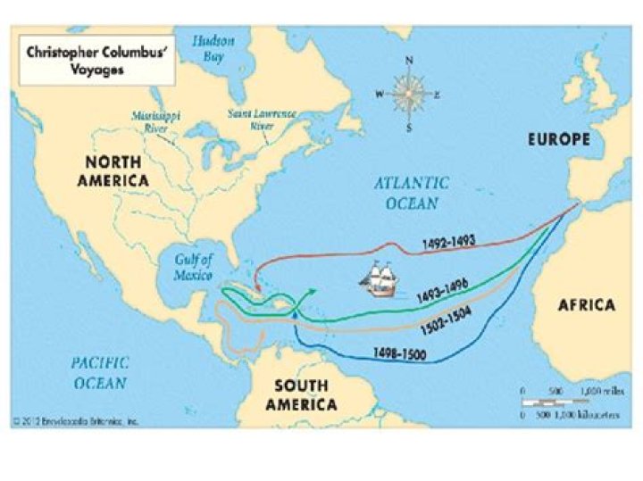 Where did Columbus hoist the flag of Spain?