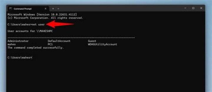 Who prints the name of the current user?