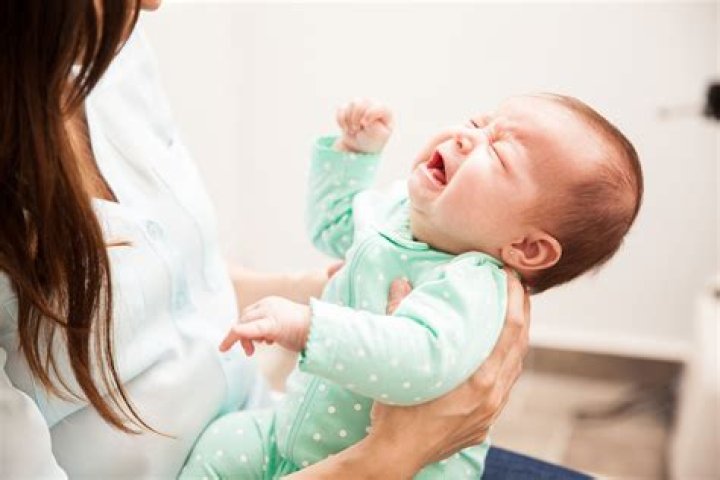 Why do babies cry when they see new faces?