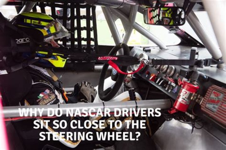 Why do Nascar drivers sit so close to the steering wheel?