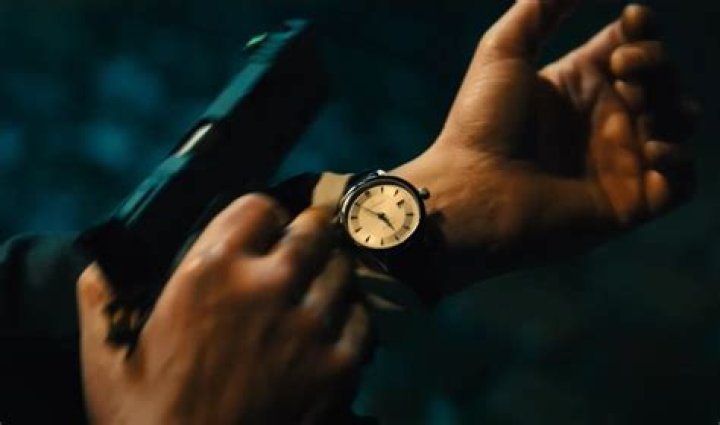 Why does John Wick wear his watch backwards?