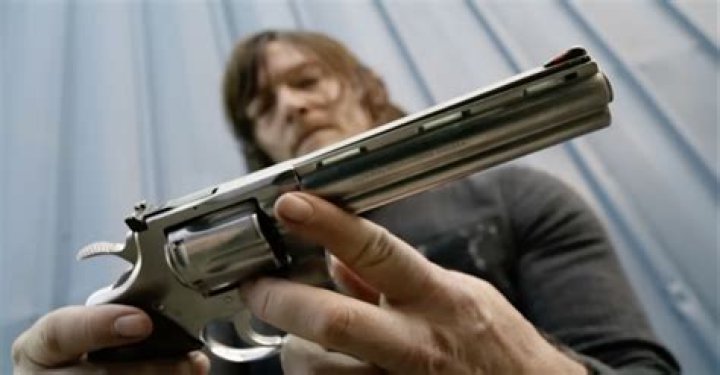 Why does Rick Grimes hold his gun like that?