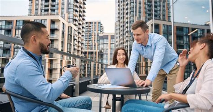 Why is it important for employees to avoid slang in the workplace?